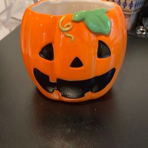Ceramic jack-o’-lantern.